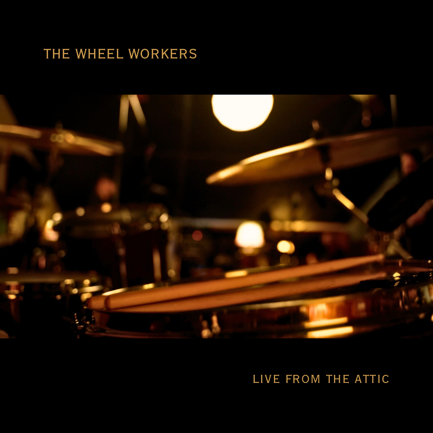 RAW AUTHENTICITY: INSIDE THE VIBRANT SONIC SANCTUARY OF THE WHEEL WORKERS’ “LIVE FROM THE ATTIC”