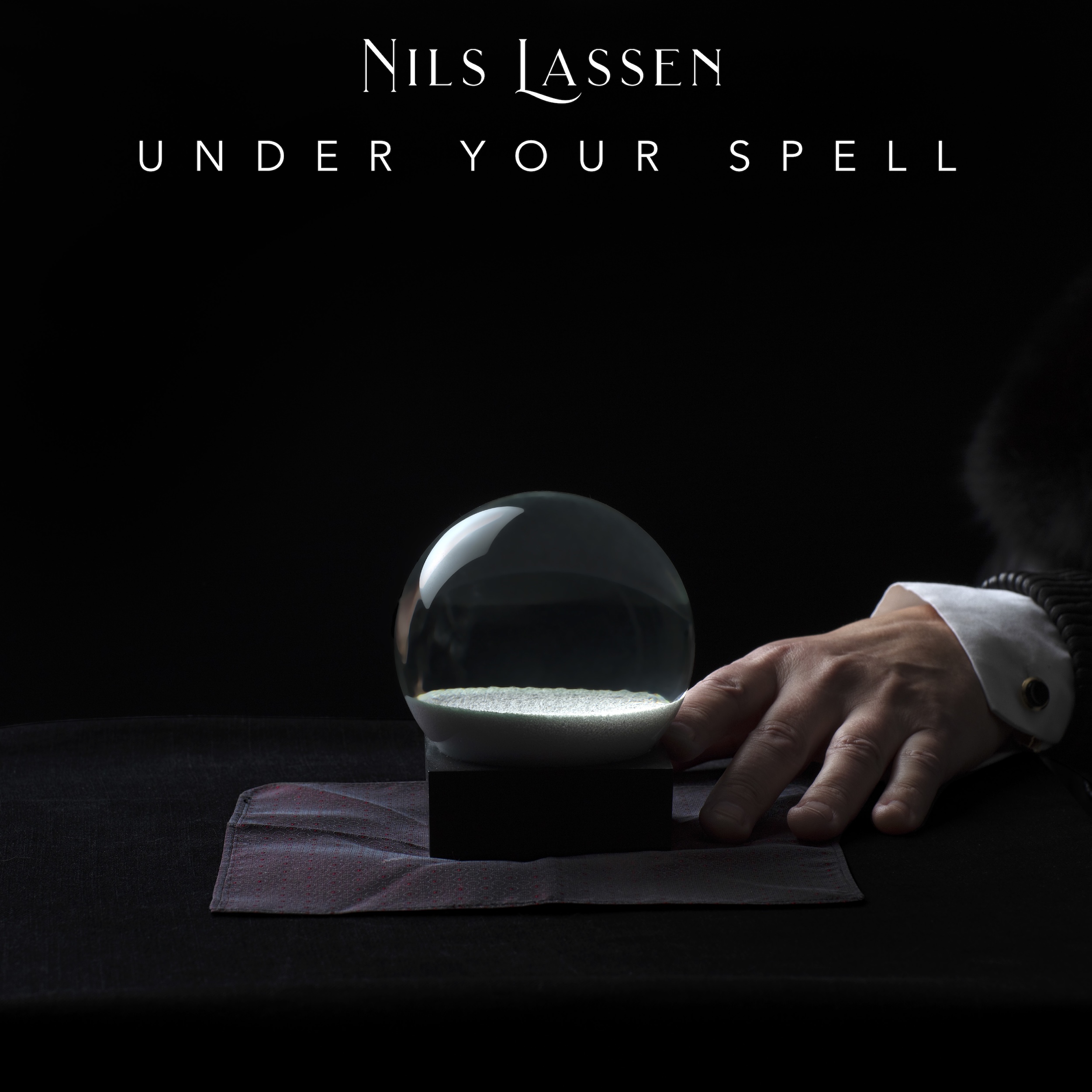 A CINEMATIC TRANCE OF DEVOTION AND OBSESSION: NILS LASSEN’S “UNDER YOUR SPELL” IS A MASTERCLASS IN SONIC DUALITY